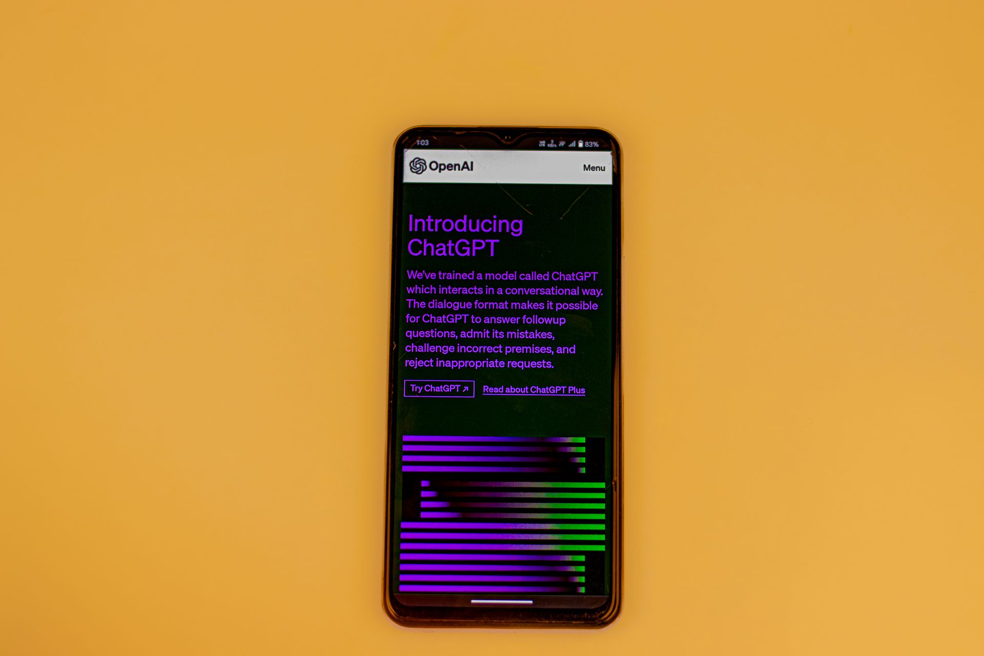 Smartphone on a yellow background showing the OpenAI ChatGPT introduction page