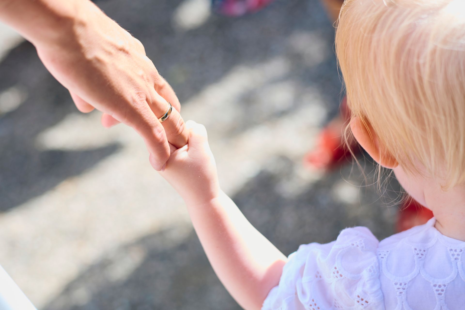 Child holding a parent's hand