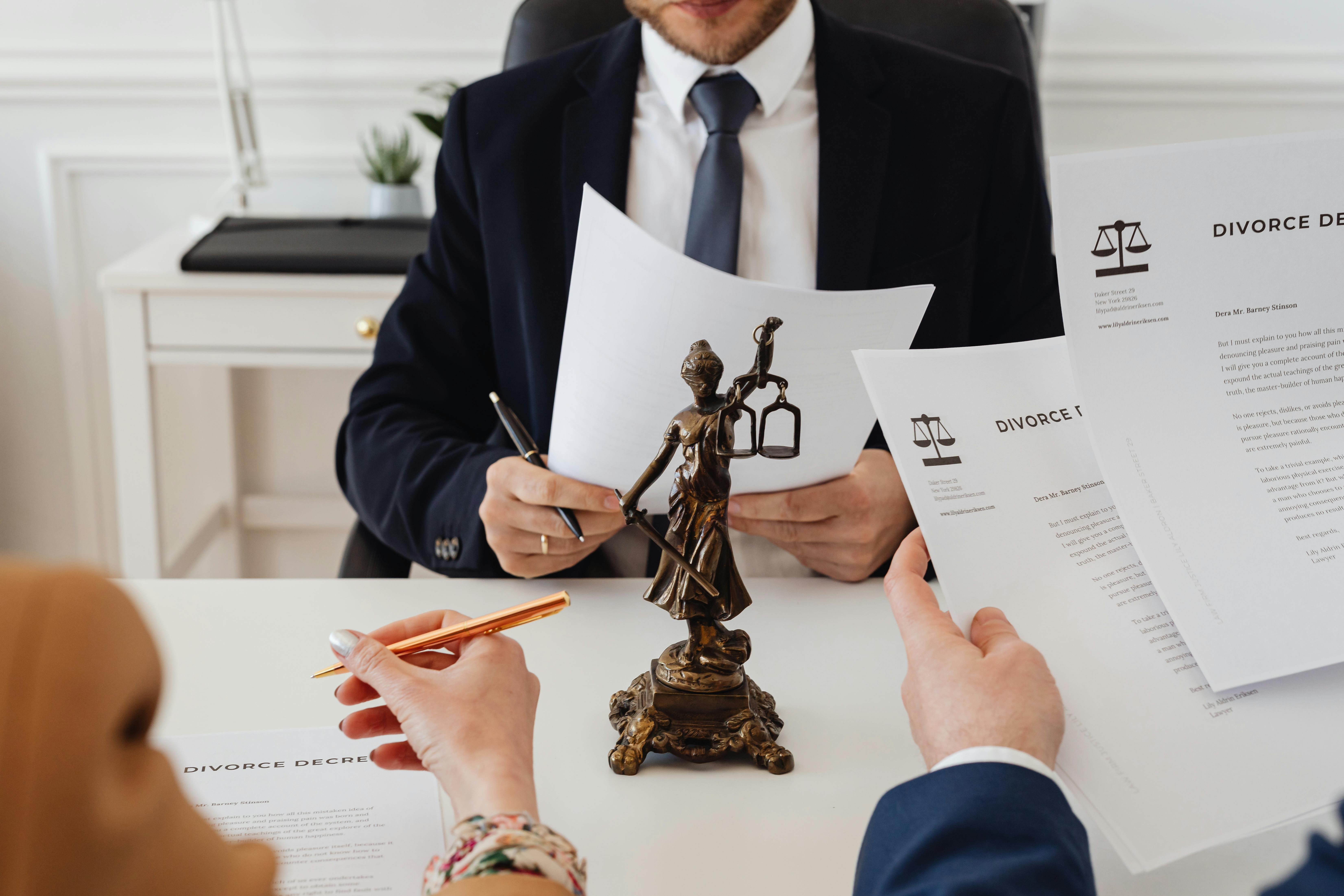 Attorney reviewing case materials at a desk
