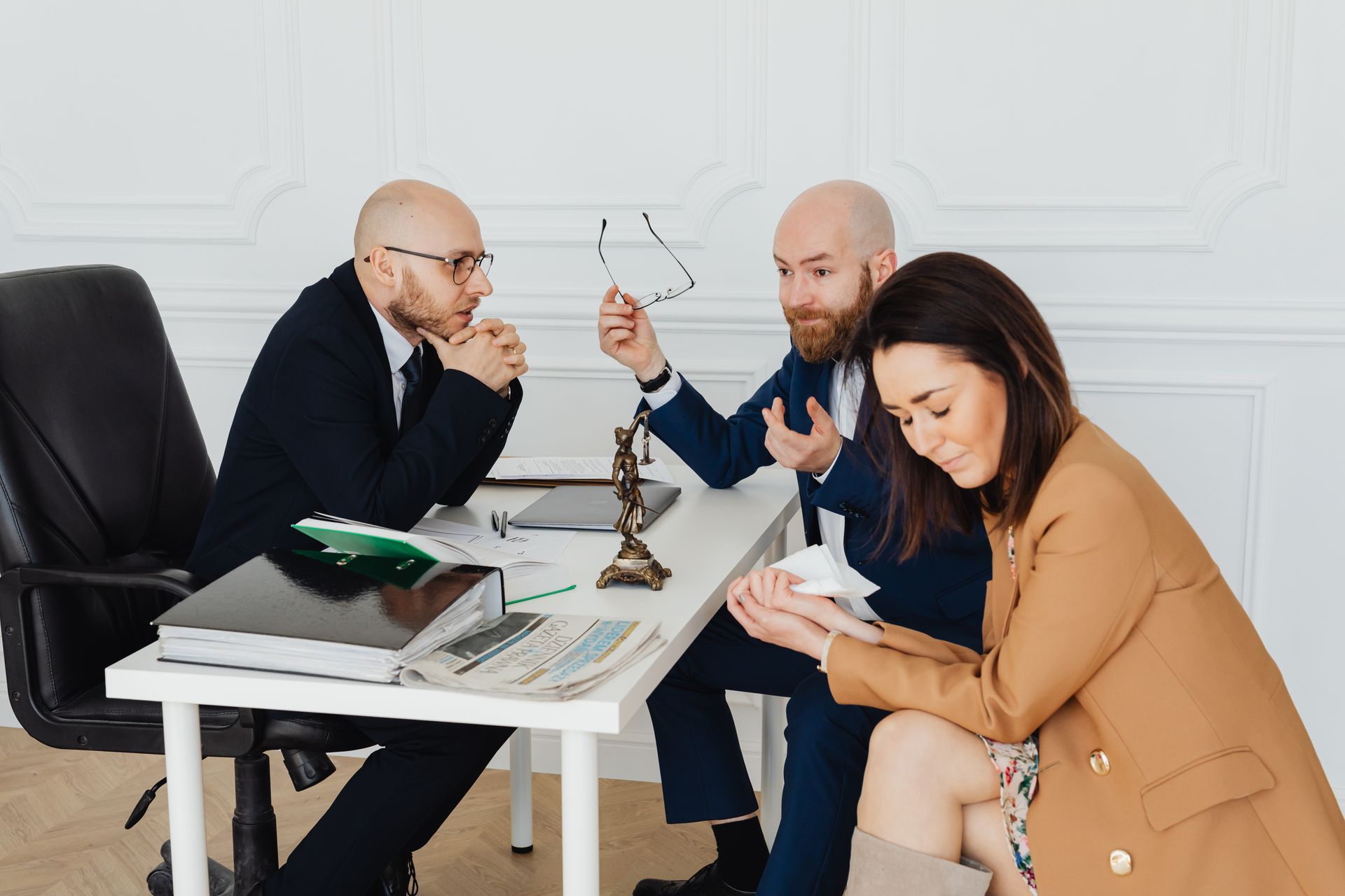 Couple in a mediation session with a family lawyer at a table