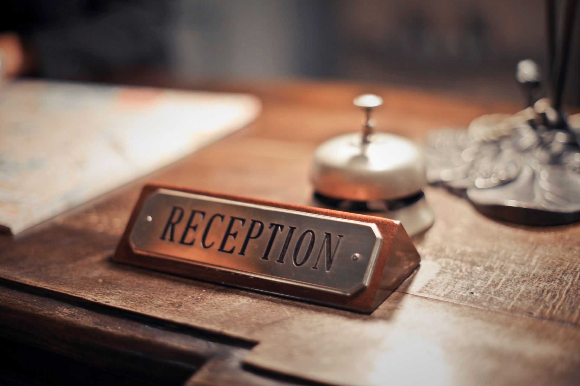 Close-up of a reception sign on an office counter
